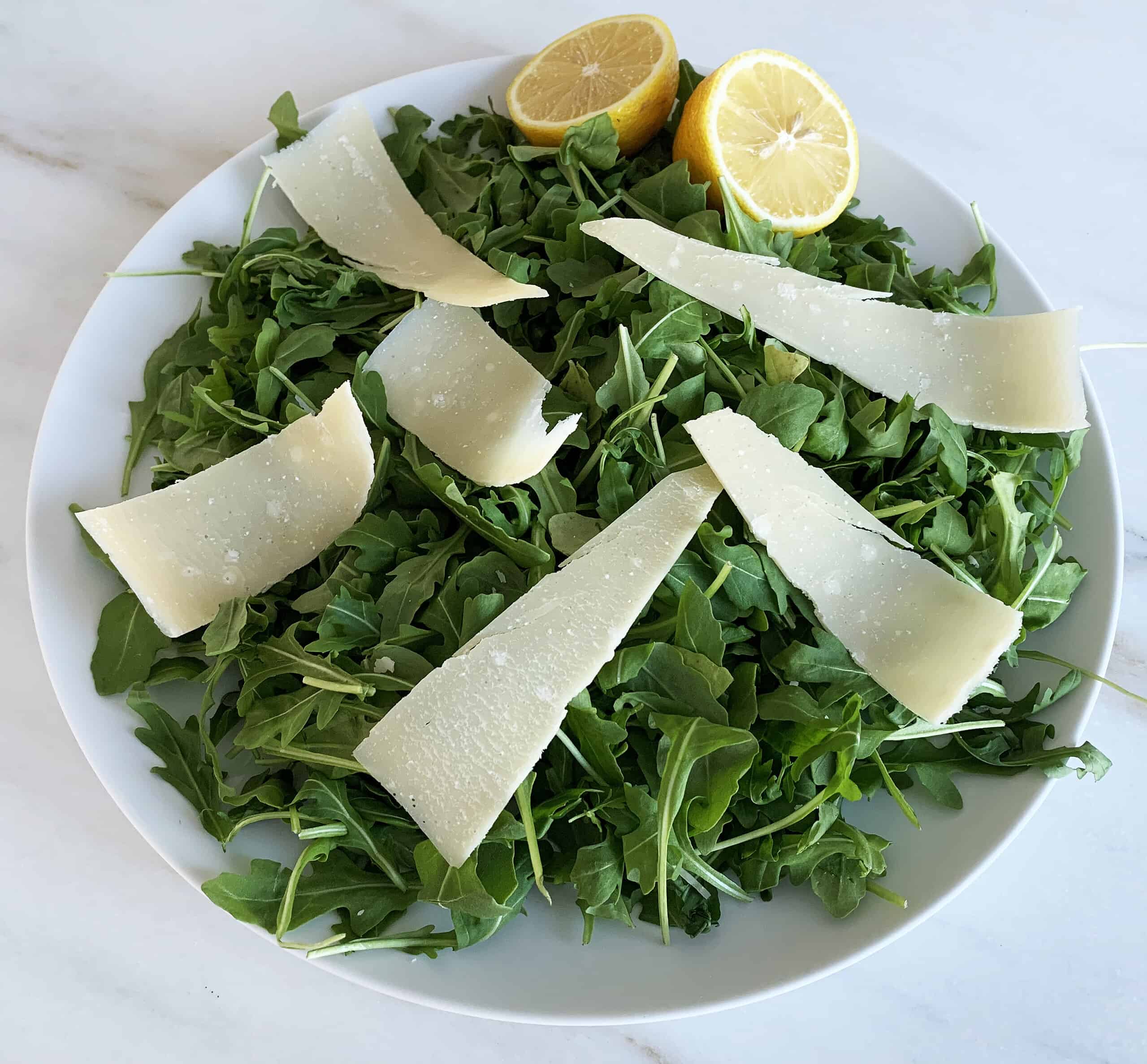 Arugula salad with lemon with shaved parmesan