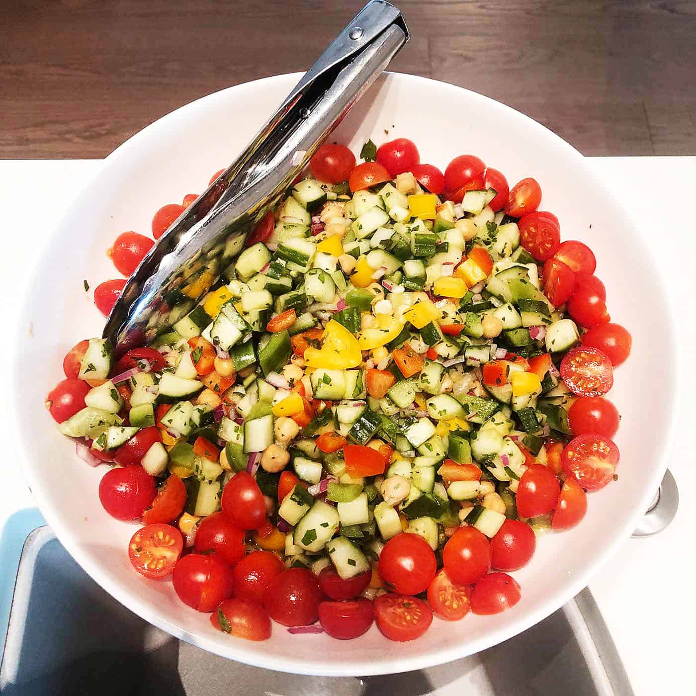 Cherry Tomatoes, Yellow bell peppers, squash, chickpeas, and herbs