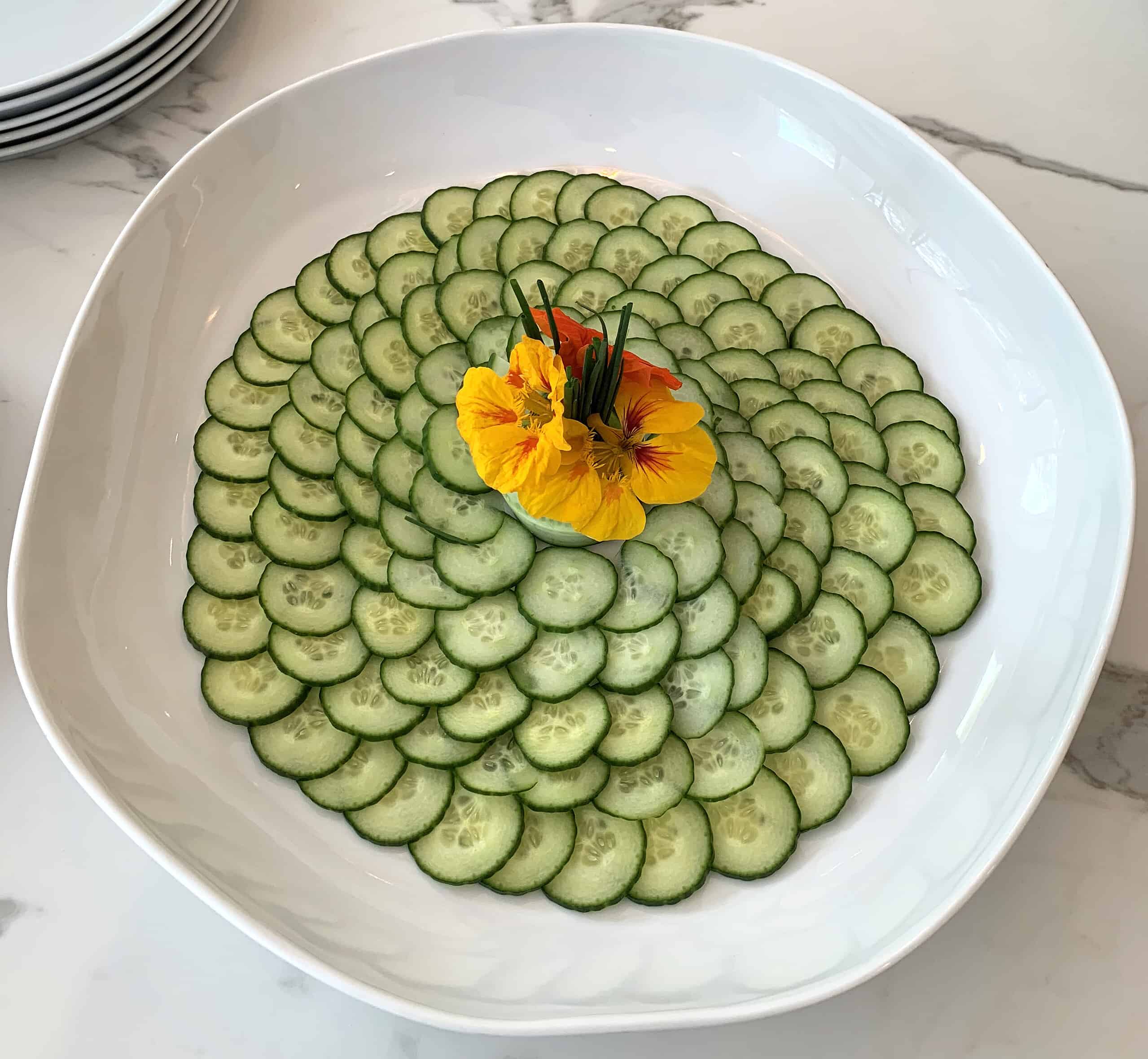 Cucumber salad with pansy garnish