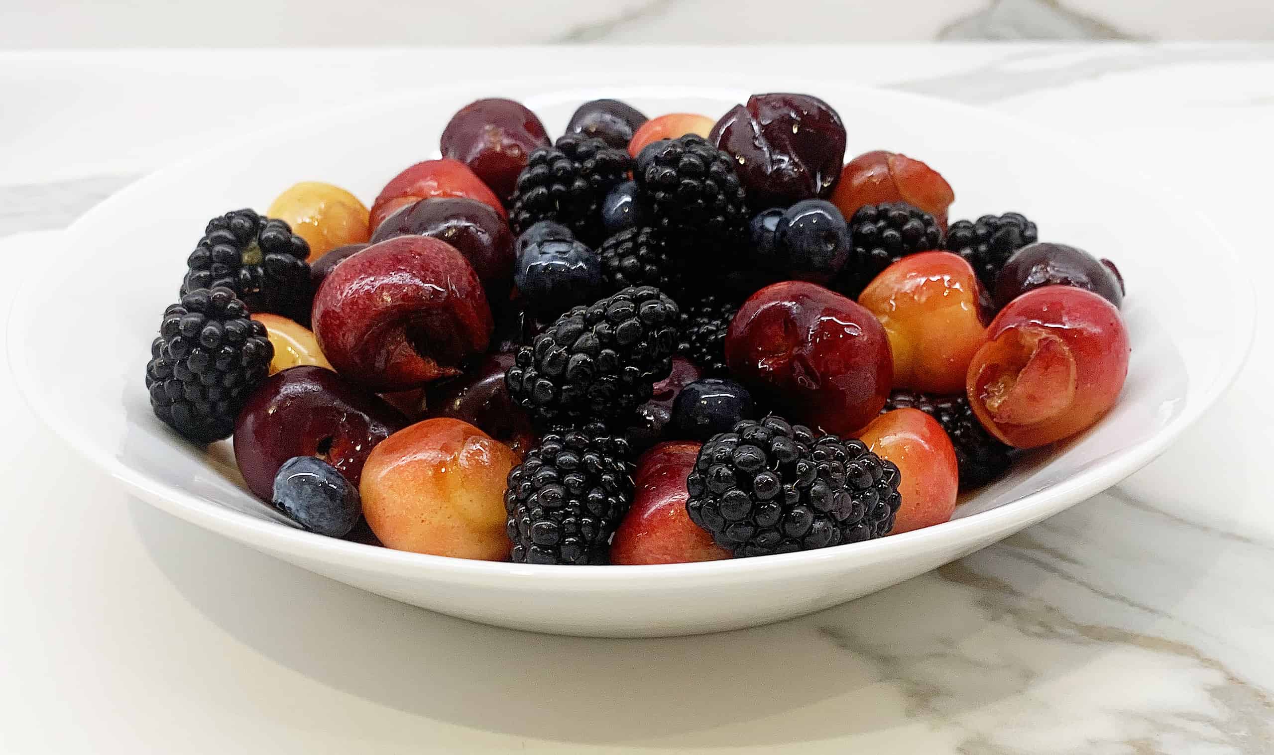 Fresh cherries, blackberries, and blueberries