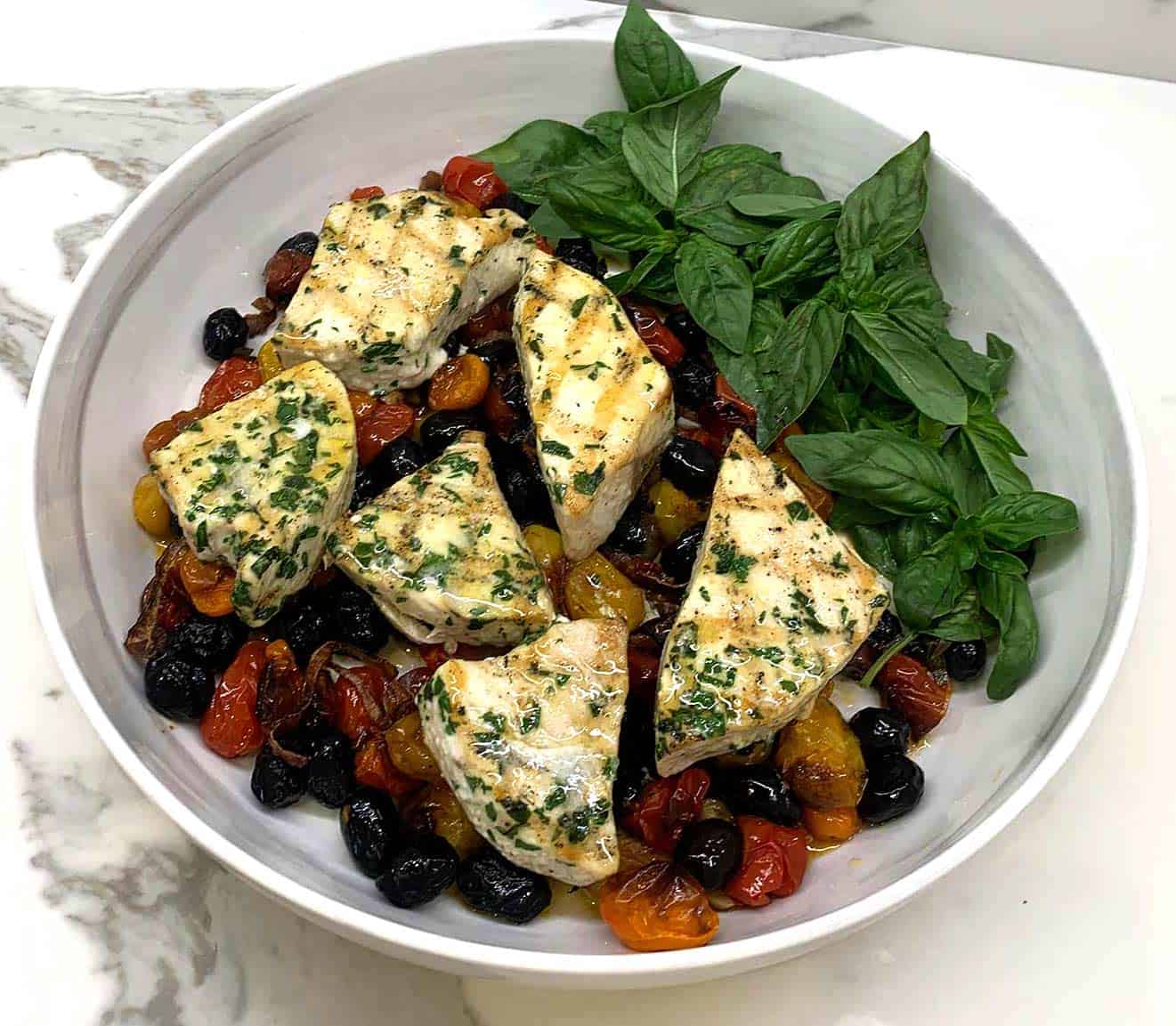 Herbed grilled swordfish over reduced sautéed, cherries and basil