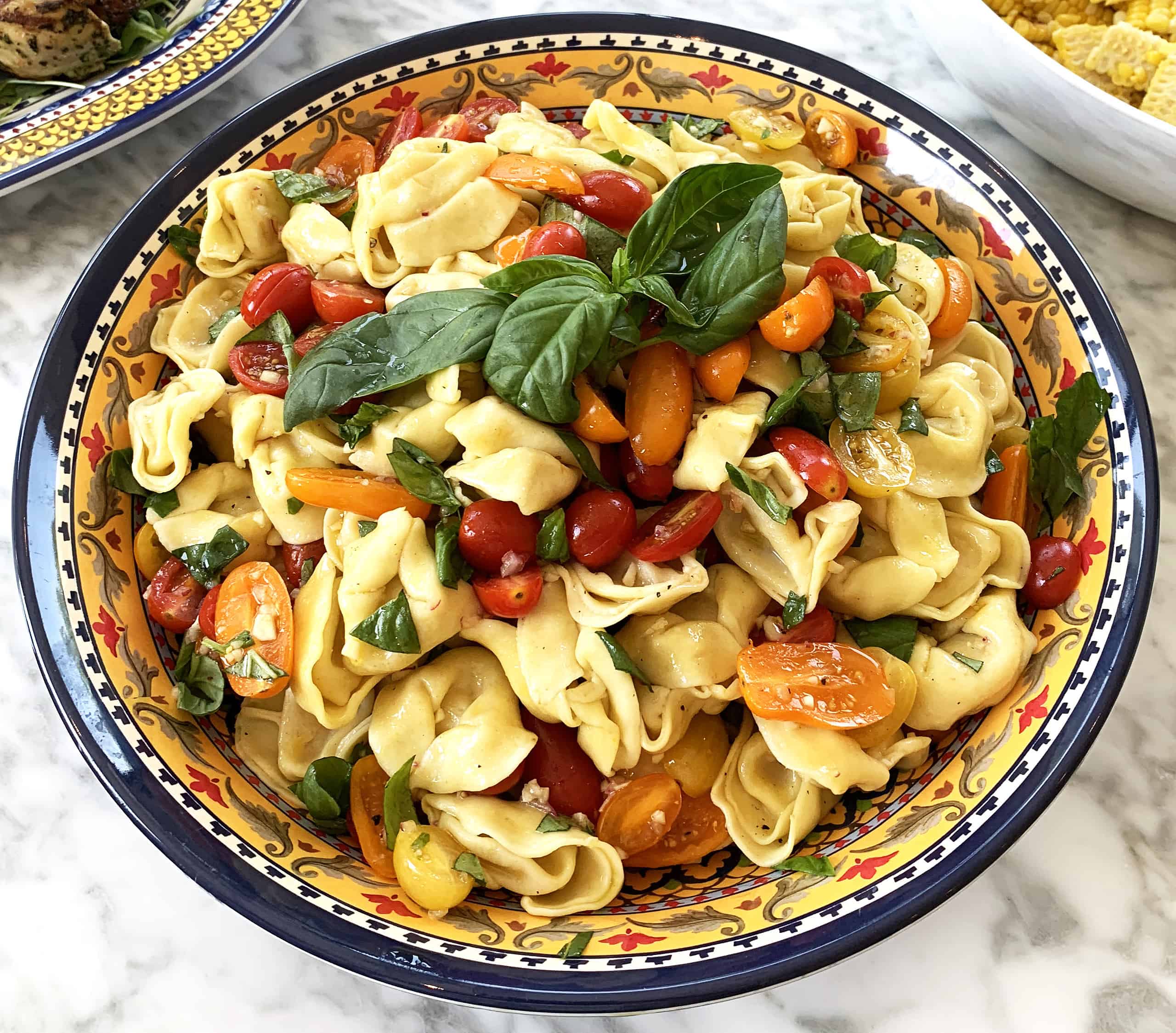 Pasta salad with grape tomatoes and basil