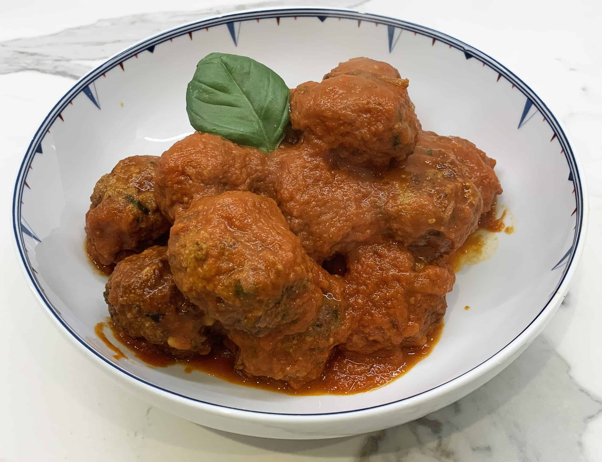 Meatballs with marinara sauce and basil