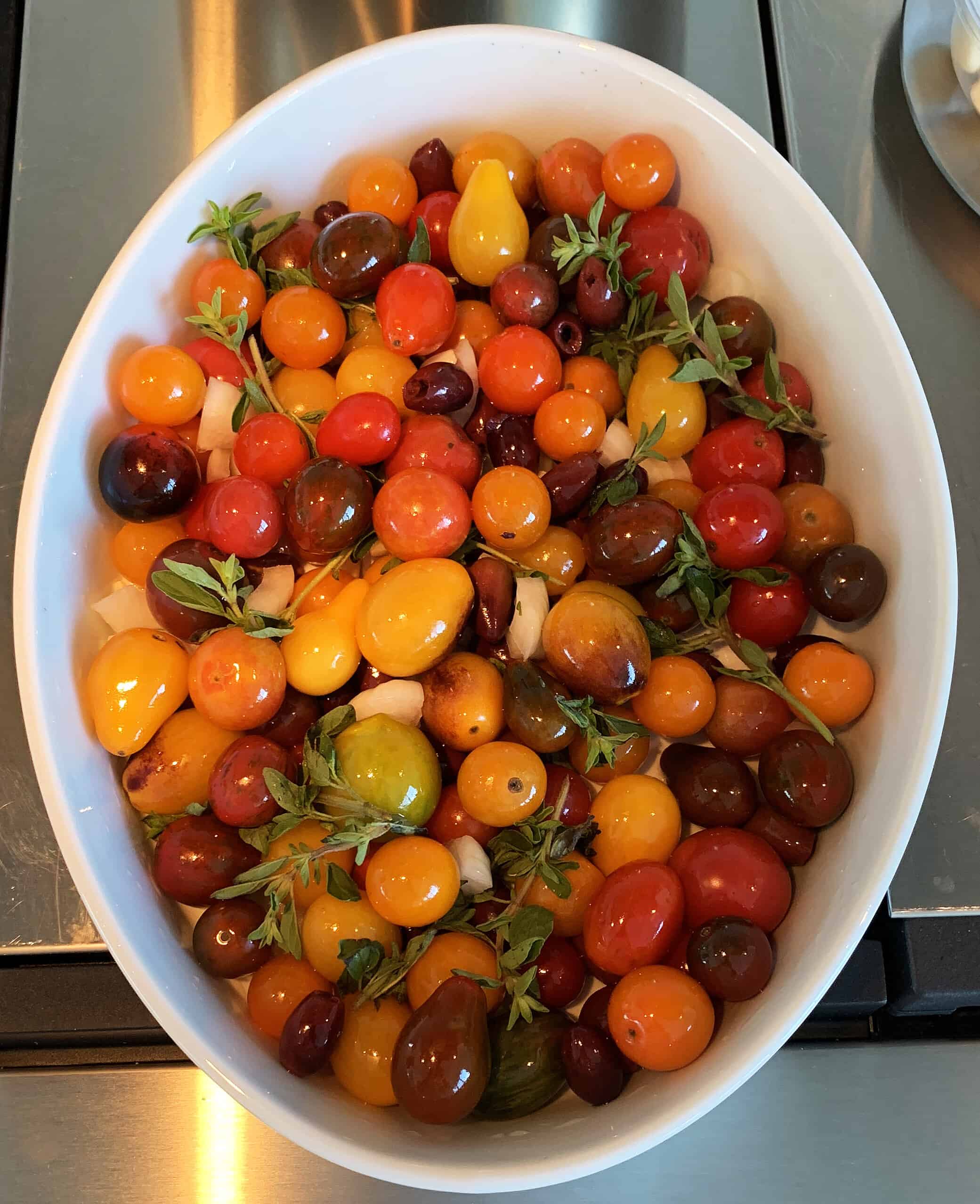 Multi colored cherry tomato salad with herbs